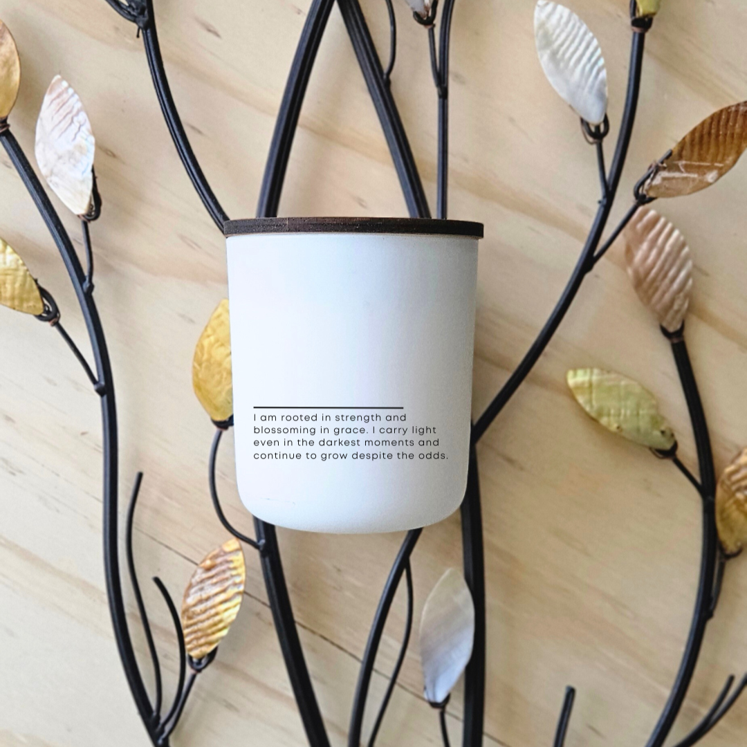 Deeply Rooted candle label reading ‘I am rooted in strength and blossoming in grace