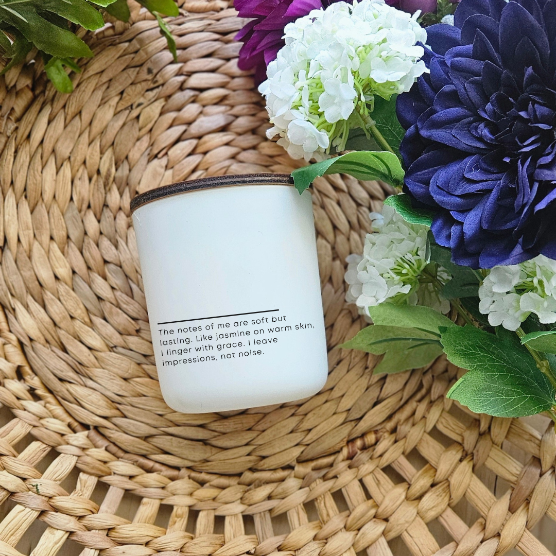 Close-up of Notes of Her candle label showing uplifting poem and elegant design