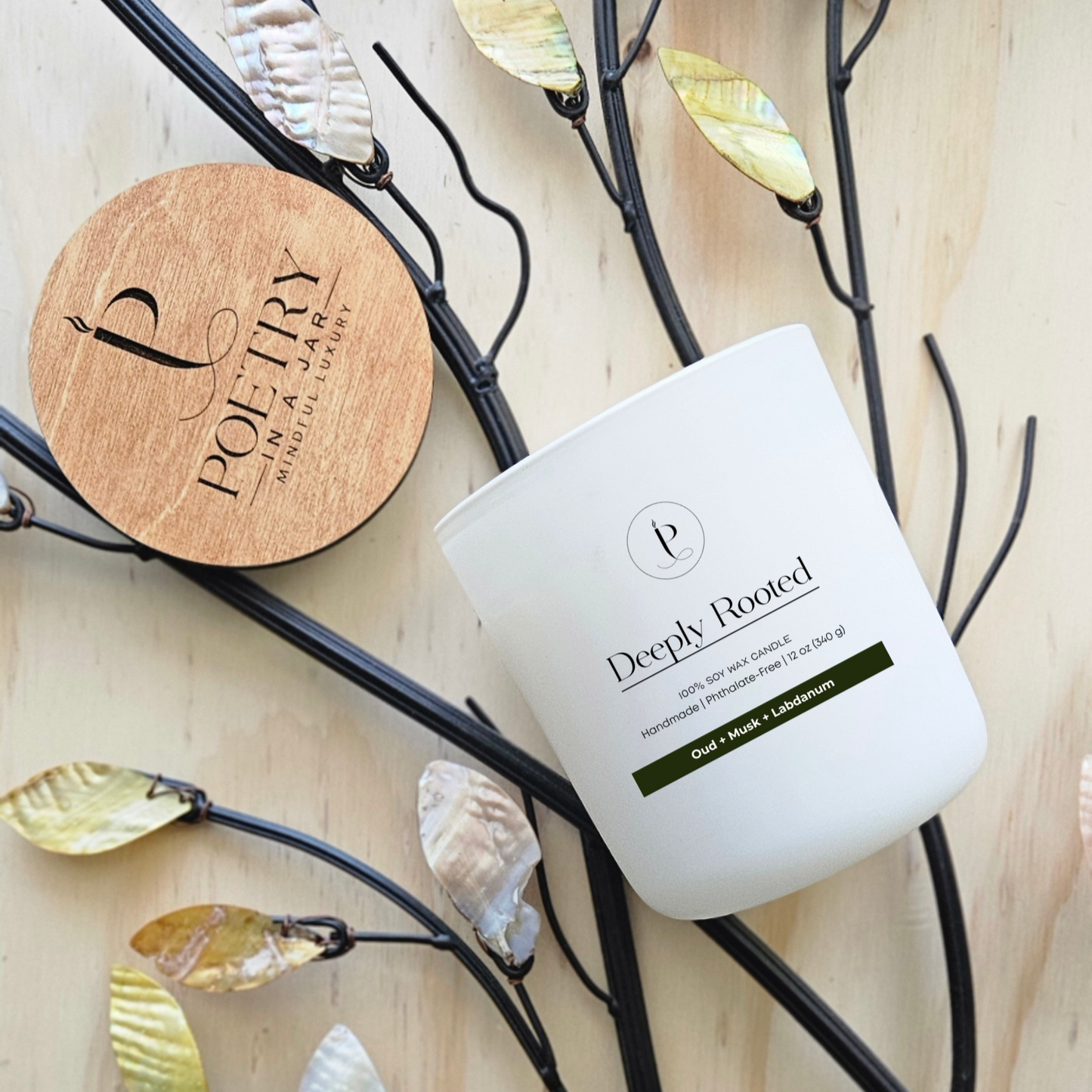 Eco-friendly soy wax candle with bamboo lid, featuring notes of oud, musk, and labdanum, offering a long-lasting, clean burn.