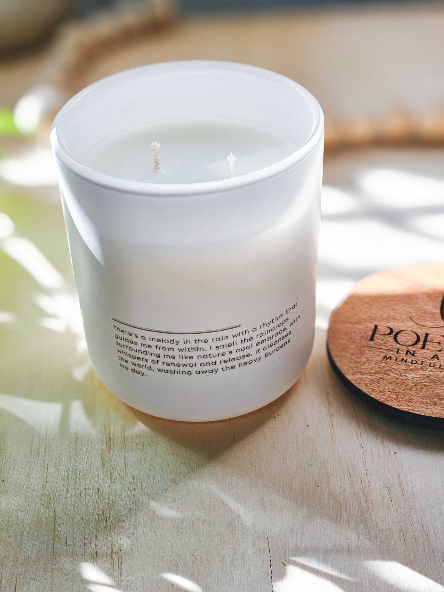 Melody of“Close-up of Melody of Rain label featuring poetic affirmation and greenery artwork Rain Handmade soy candle with affirmations on the back.