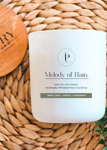 “Eco-friendly glass jar with bamboo lid holding Melody of Rain vegan soy wax candle”